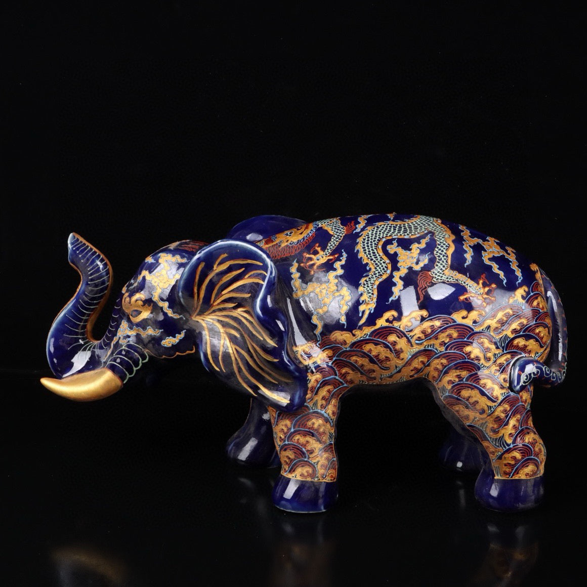 Elephant with colorful golden cloud and dragon patterns