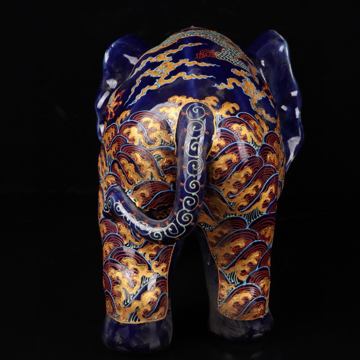 Elephant with colorful golden cloud and dragon patterns
