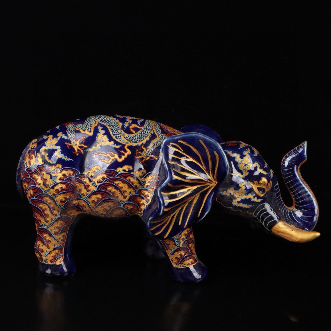 Elephant with colorful golden cloud and dragon patterns