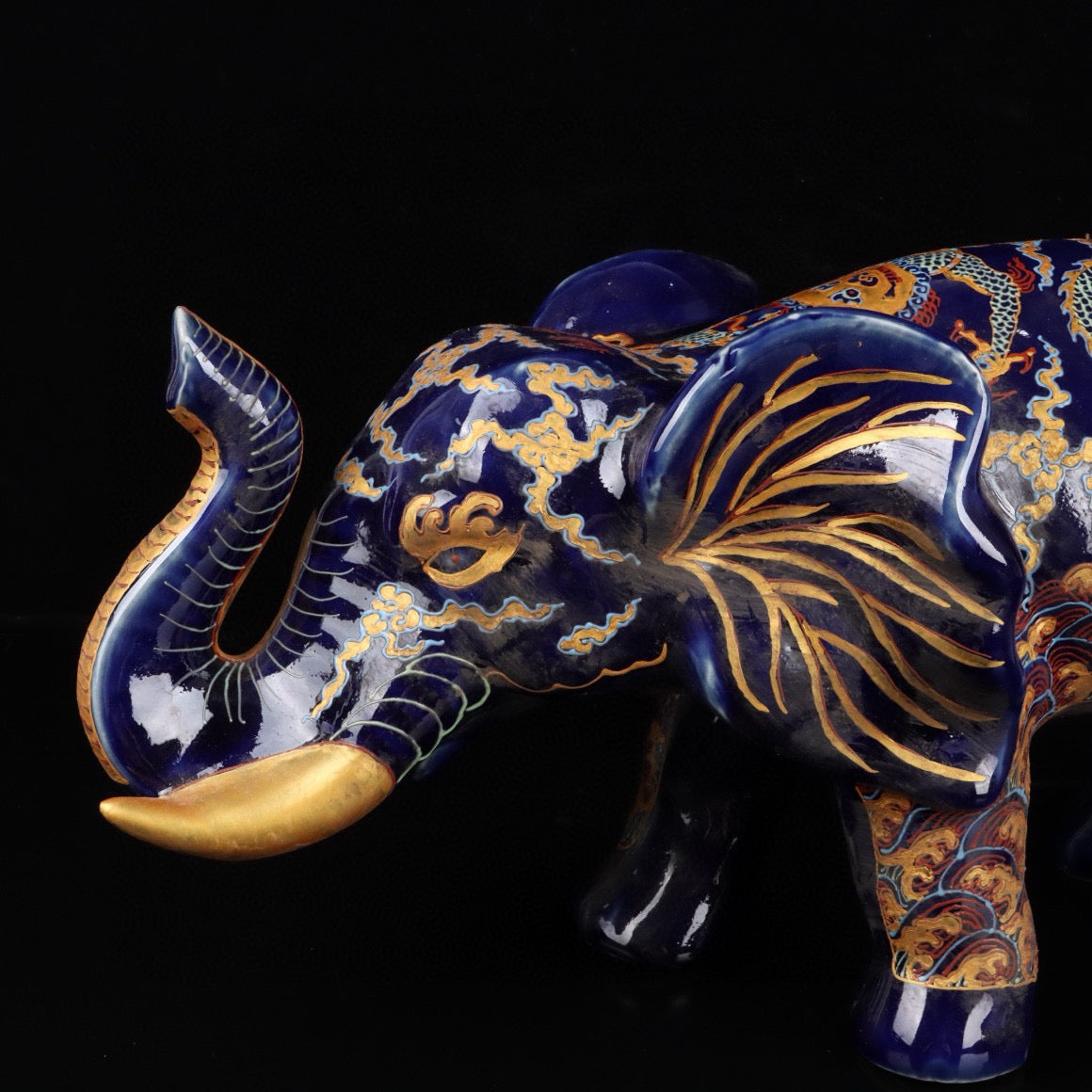 Elephant with colorful golden cloud and dragon patterns