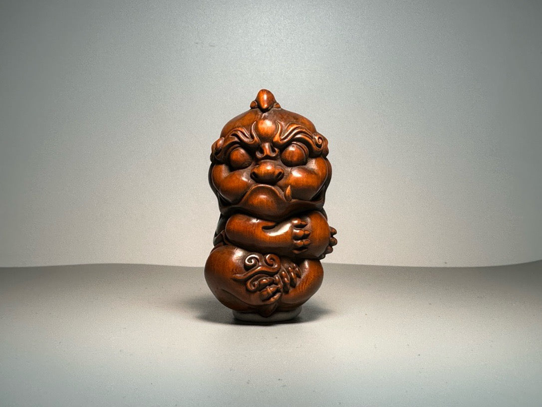 Chinese antique boxwood carving with exquisite craftsmanship, featuring a unicorn Pixiu holding a ball