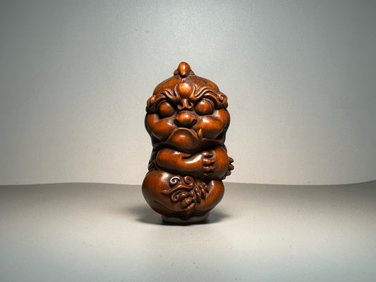 Chinese antique boxwood carving with exquisite craftsmanship, featuring a unicorn Pixiu holding a ball