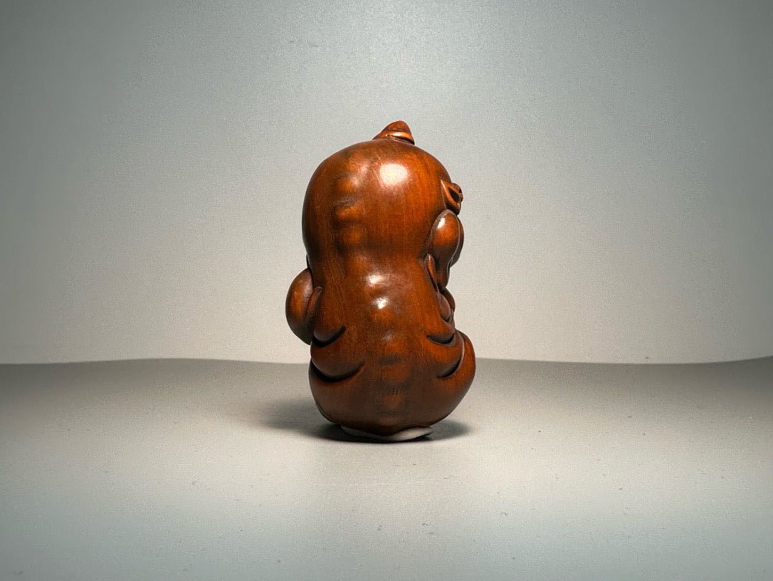 Chinese antique boxwood carving with exquisite craftsmanship, featuring a unicorn Pixiu holding a ball