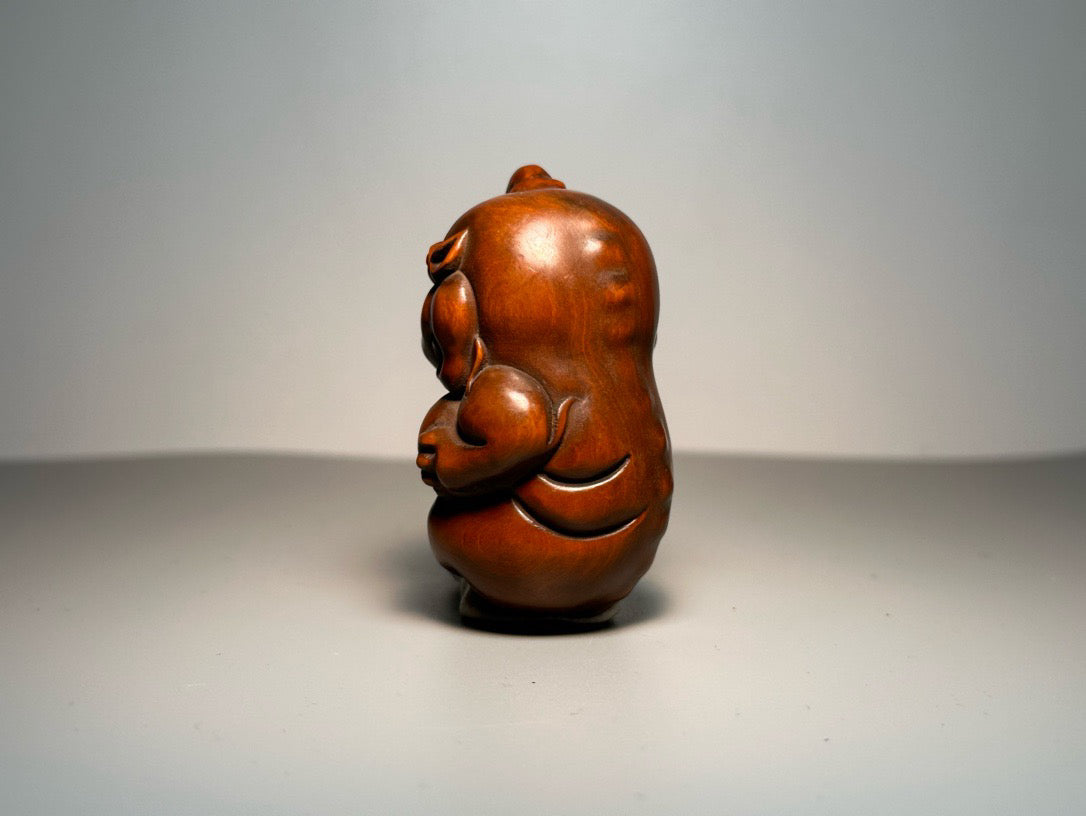 Chinese antique boxwood carving with exquisite craftsmanship, featuring a unicorn Pixiu holding a ball