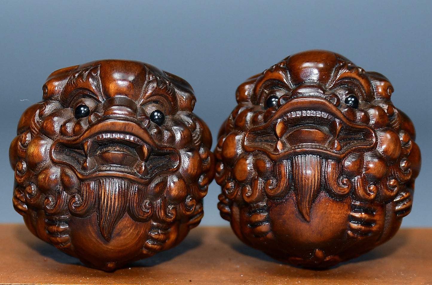 Collection of boxwood carved lion pairs of decorative health balls
