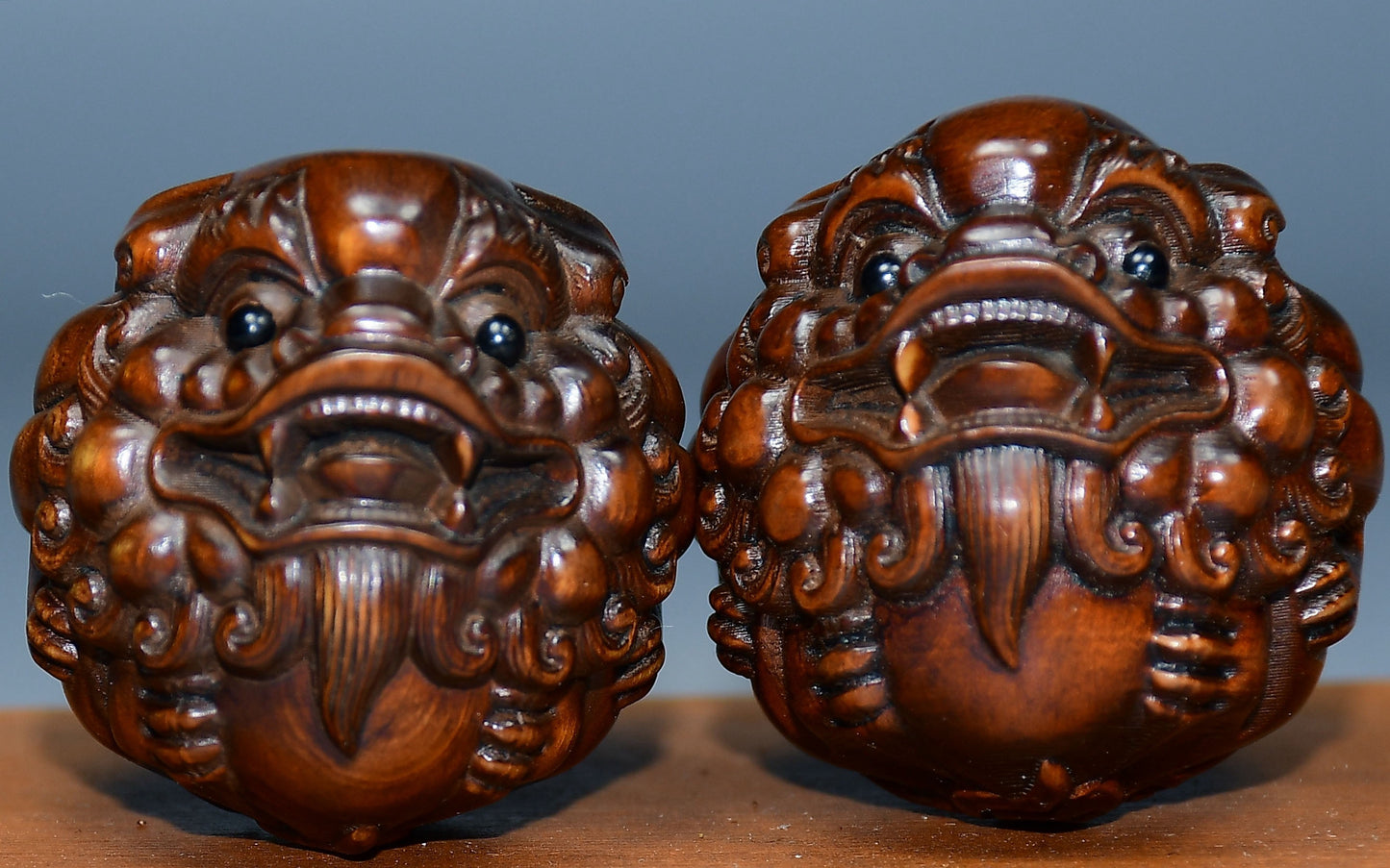 Collection of boxwood carved lion pairs of decorative health balls