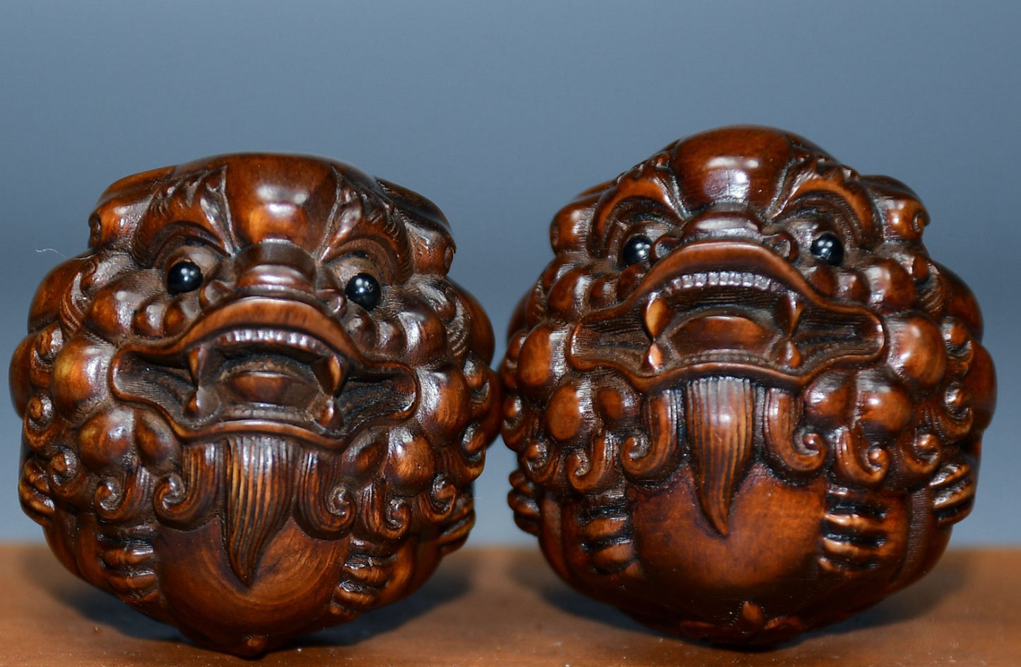 Collection of boxwood carved lion pairs of decorative health balls