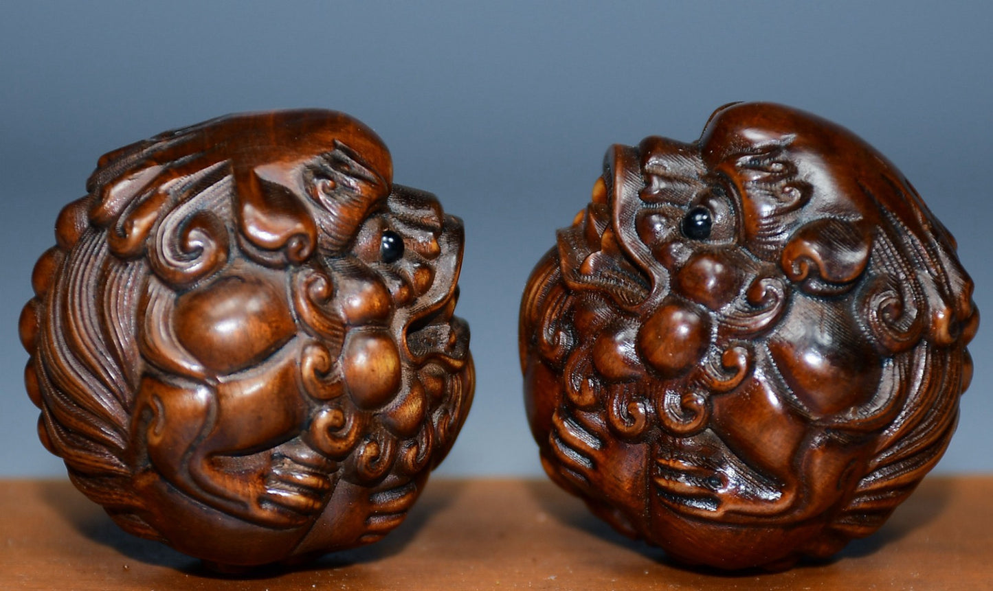 Collection of boxwood carved lion pairs of decorative health balls