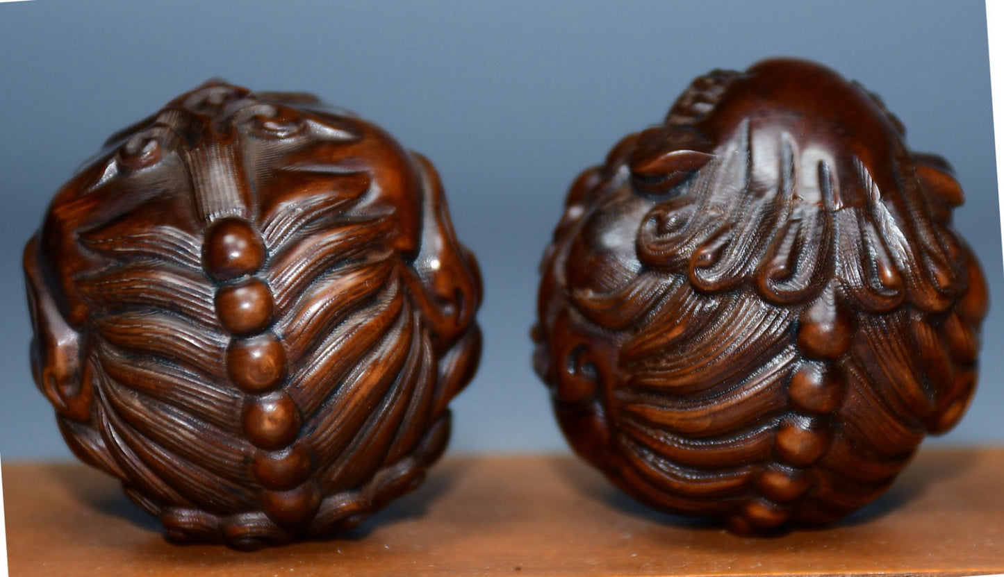 Collection of boxwood carved lion pairs of decorative health balls