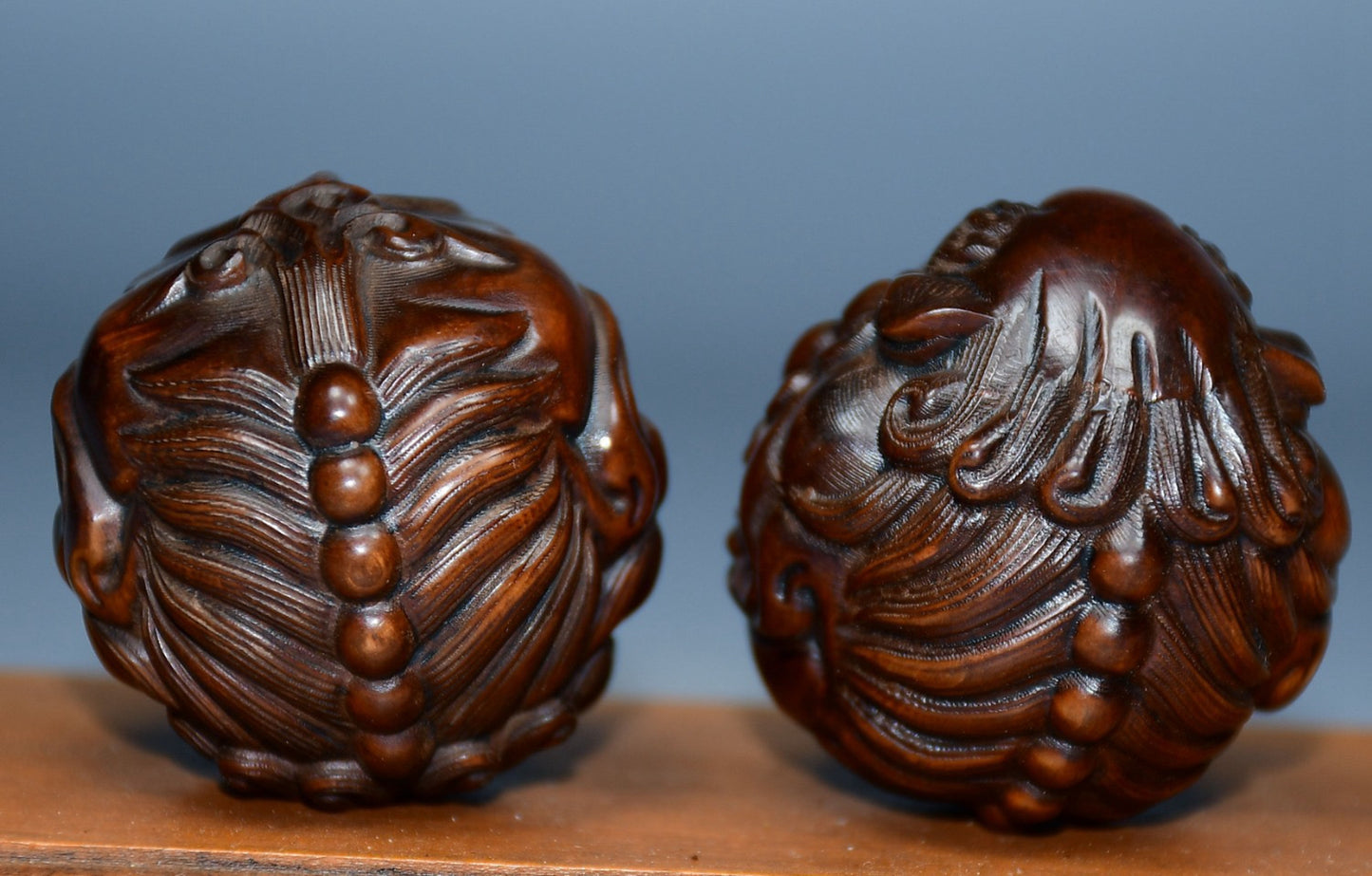 Collection of boxwood carved lion pairs of decorative health balls
