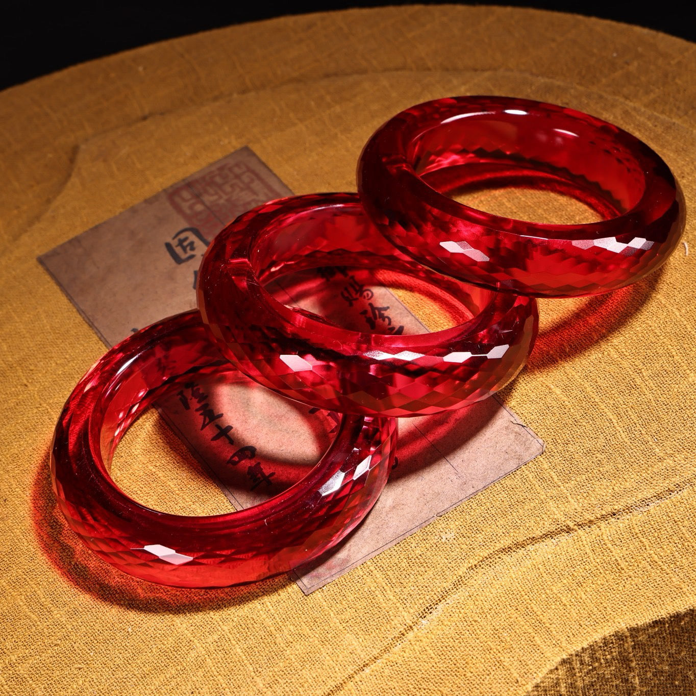 A box of red diamond gemstone cut bracelets