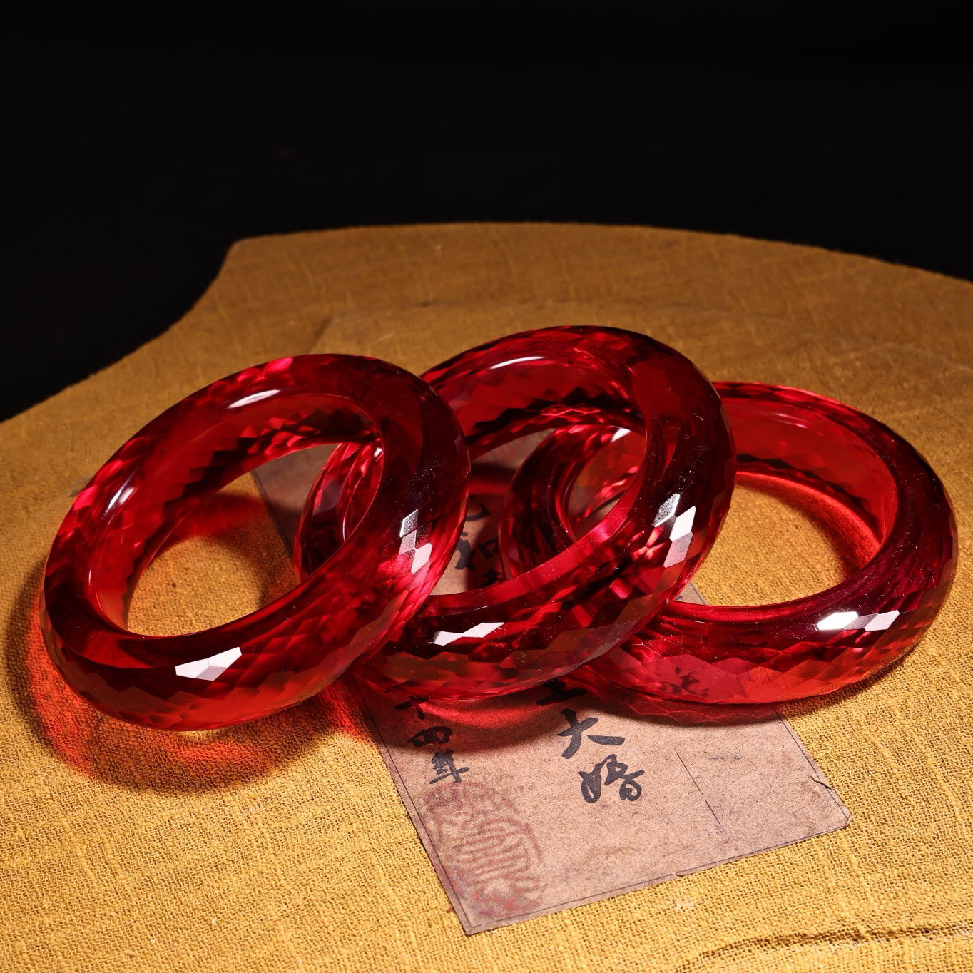 A box of red diamond gemstone cut bracelets