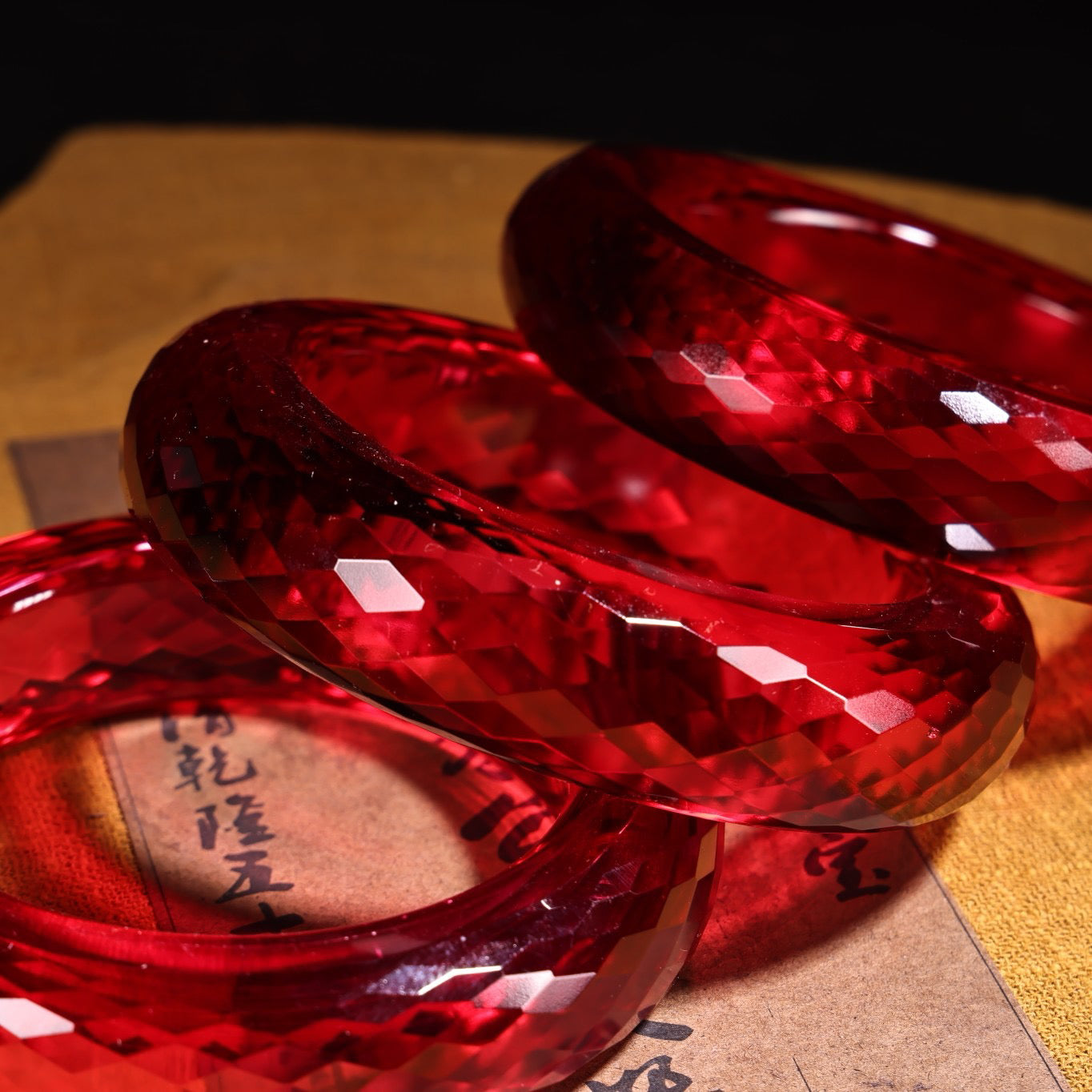 A box of red diamond gemstone cut bracelets