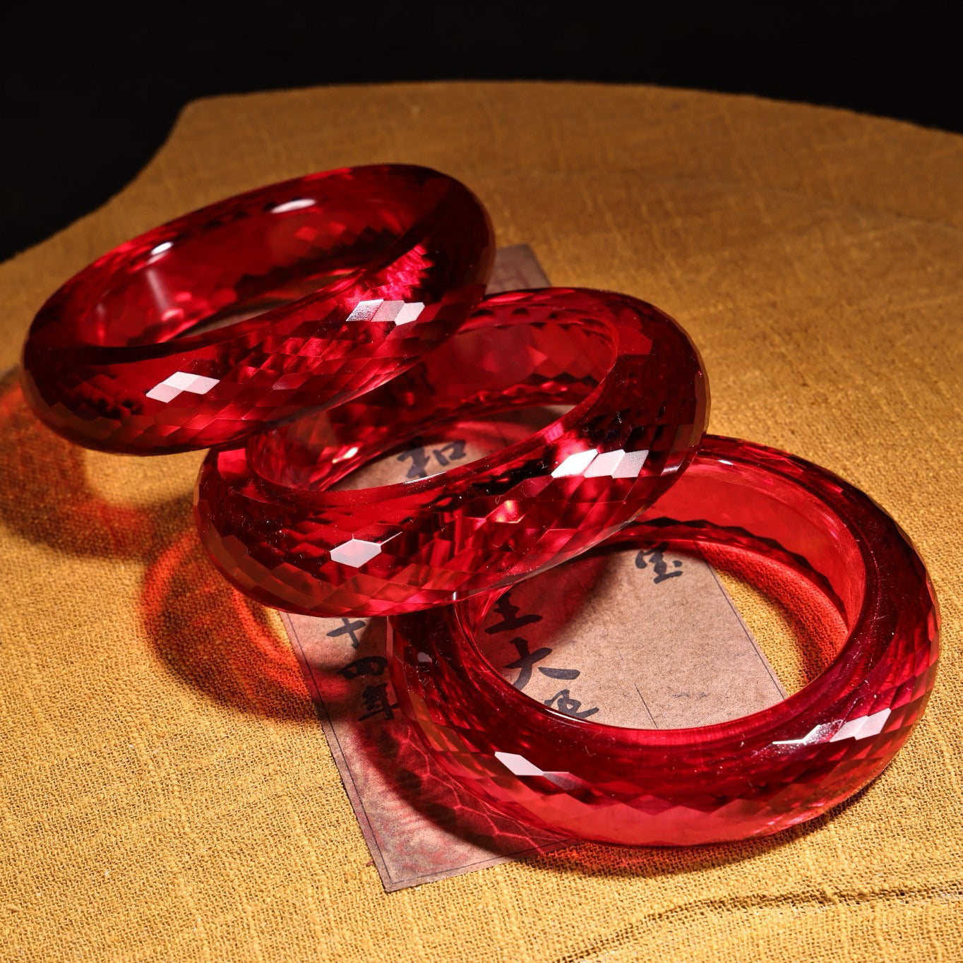 A box of red diamond gemstone cut bracelets