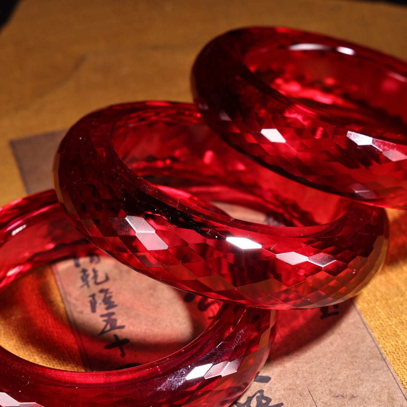 A box of red diamond gemstone cut bracelets