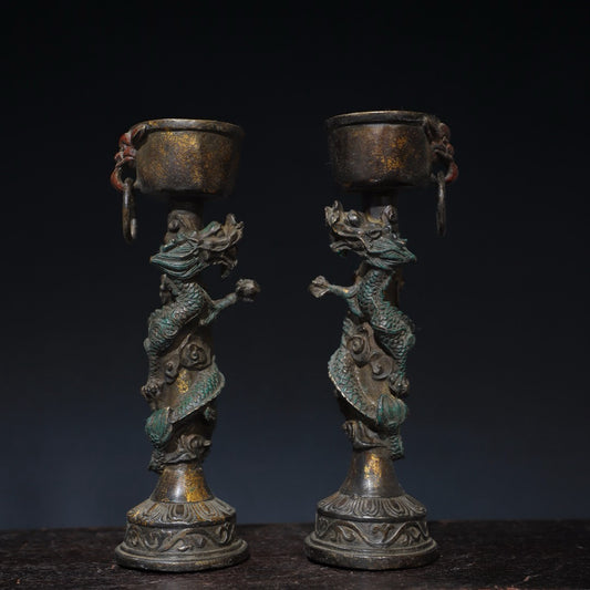 A pair of pure copper double dragon candle holders