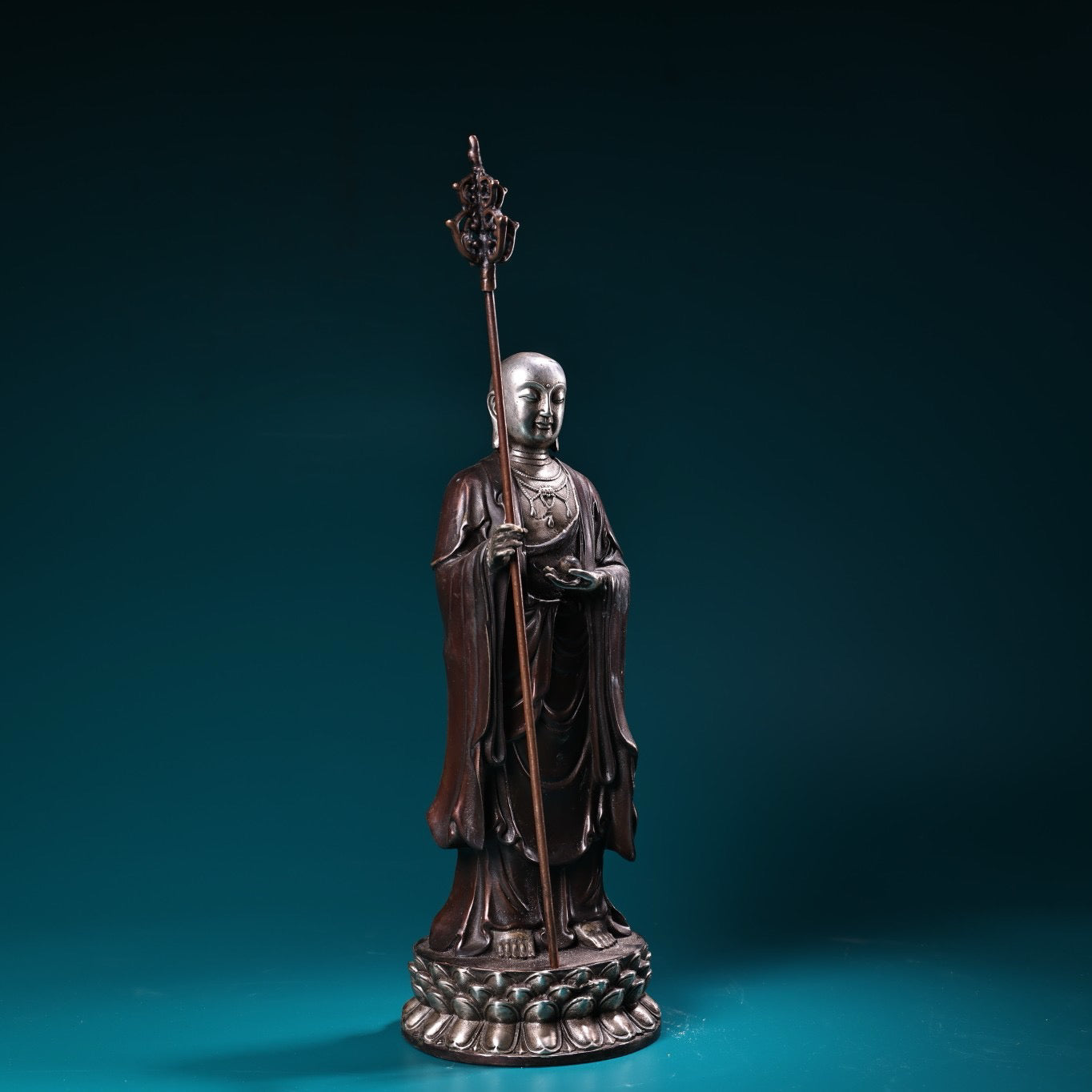 A pure copper high relief carved and gilded silver statue of the Ksitigarbha Bodhisattva