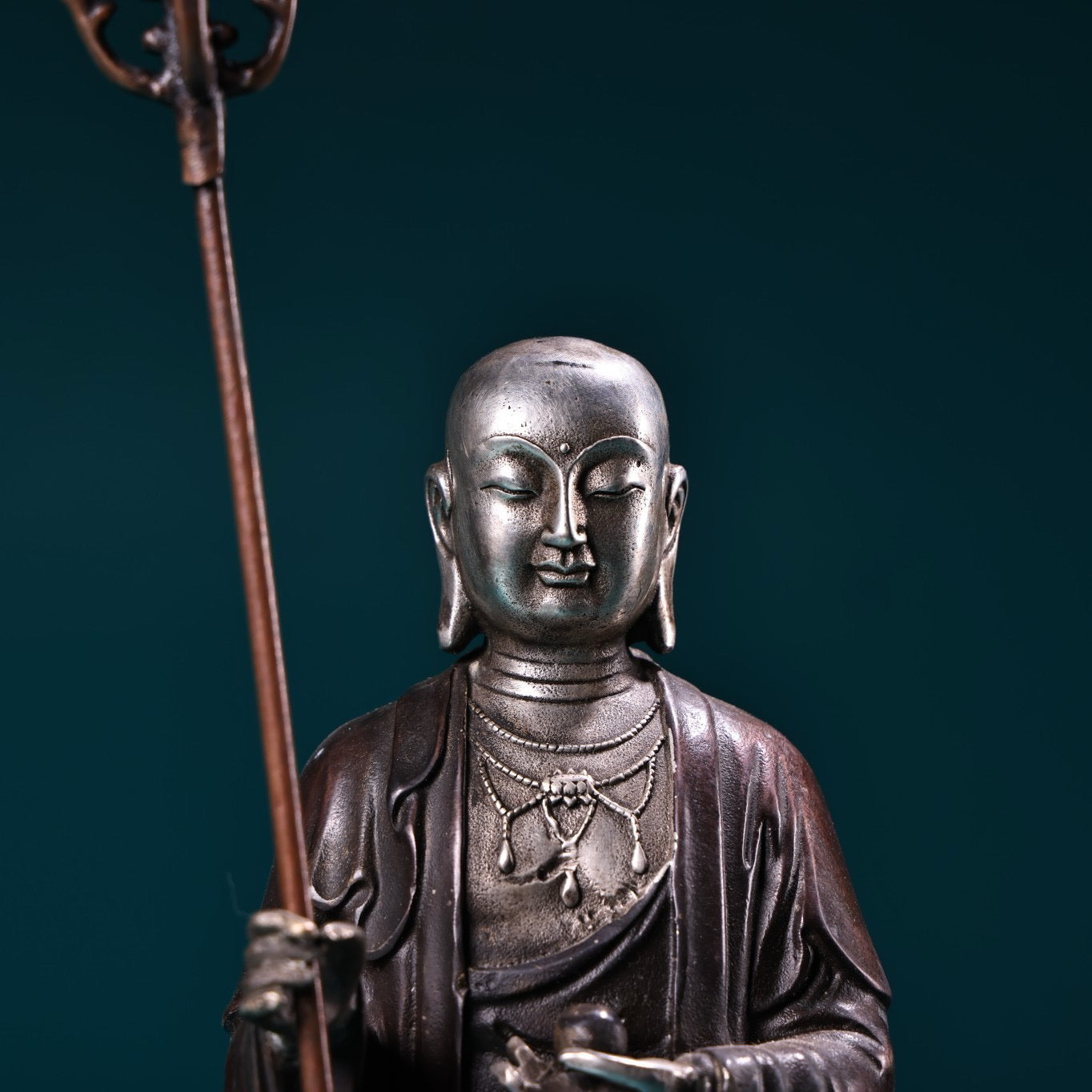A pure copper high relief carved and gilded silver statue of the Ksitigarbha Bodhisattva