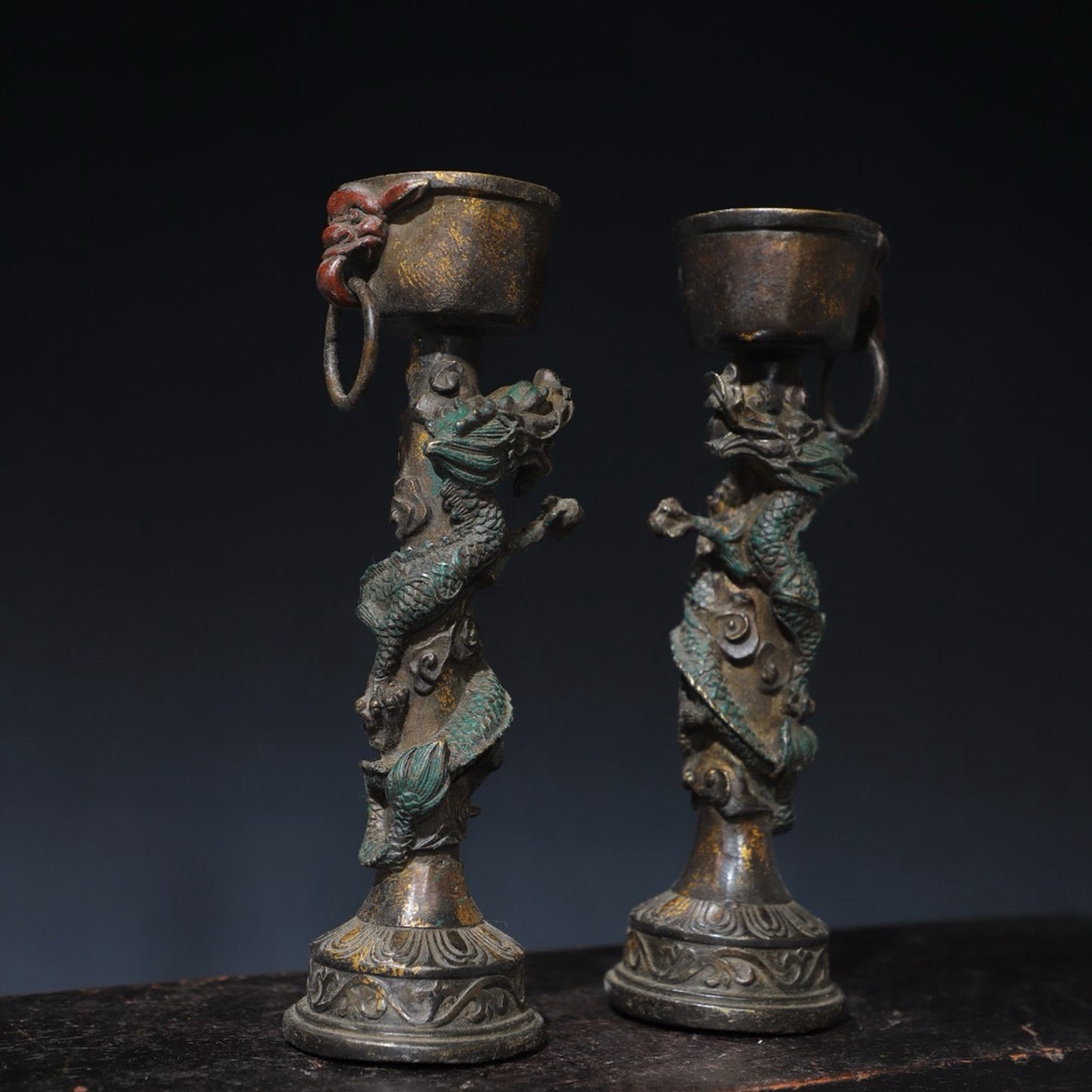 A pair of pure copper double dragon candle holders