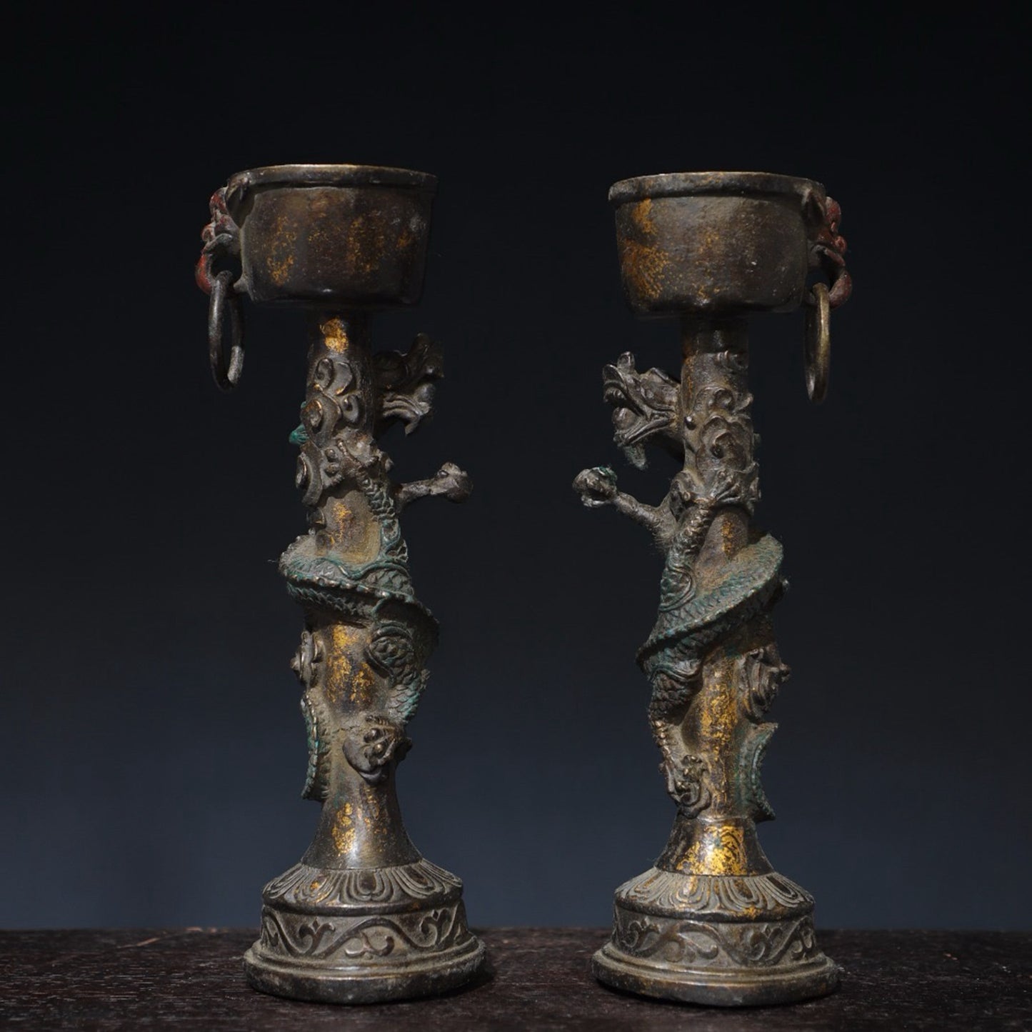 A pair of pure copper double dragon candle holders