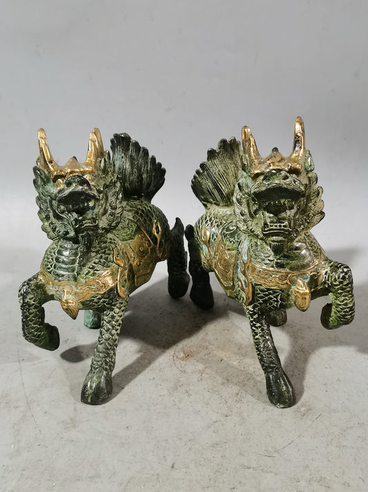 A pair of Chinese antique chubby qilin