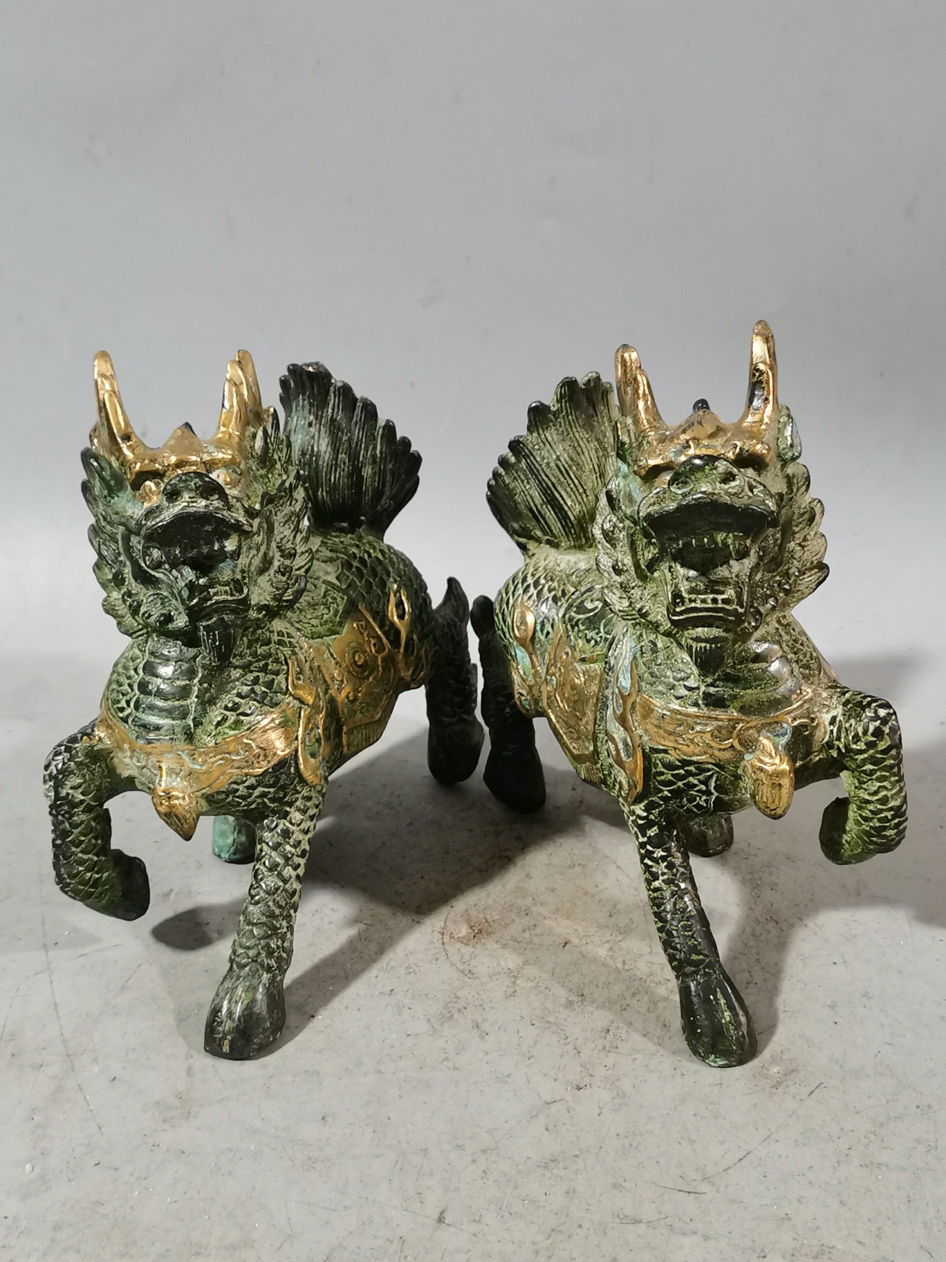 A pair of Chinese antique chubby qilin