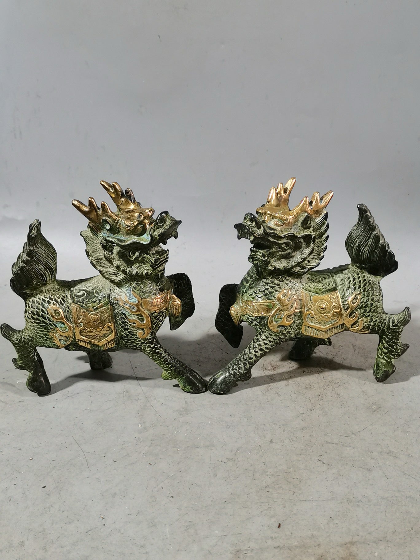 A pair of Chinese antique chubby qilin