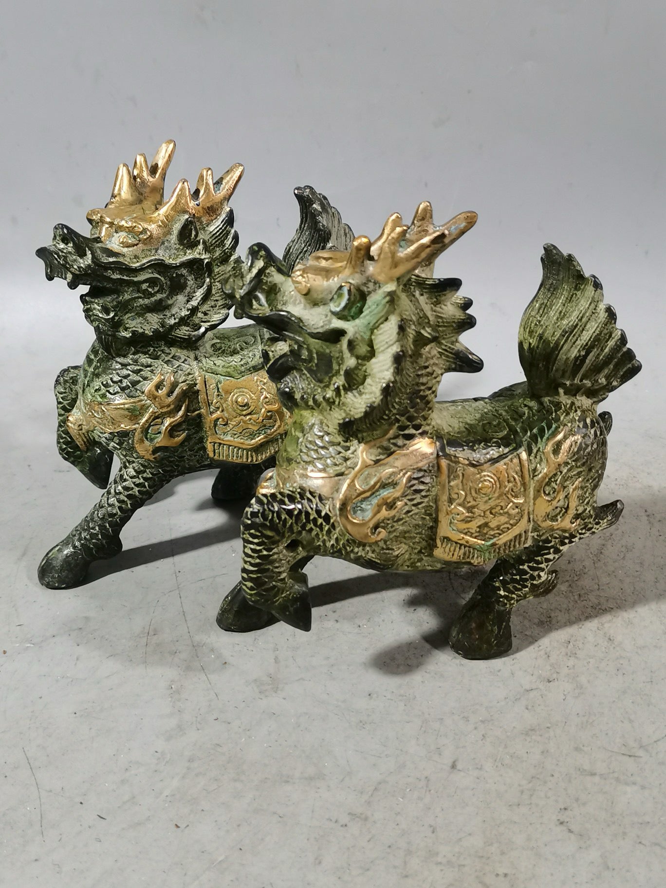 A pair of Chinese antique chubby qilin