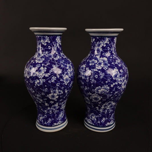 A pair of blue and white ice plum patterned fish tail bottles