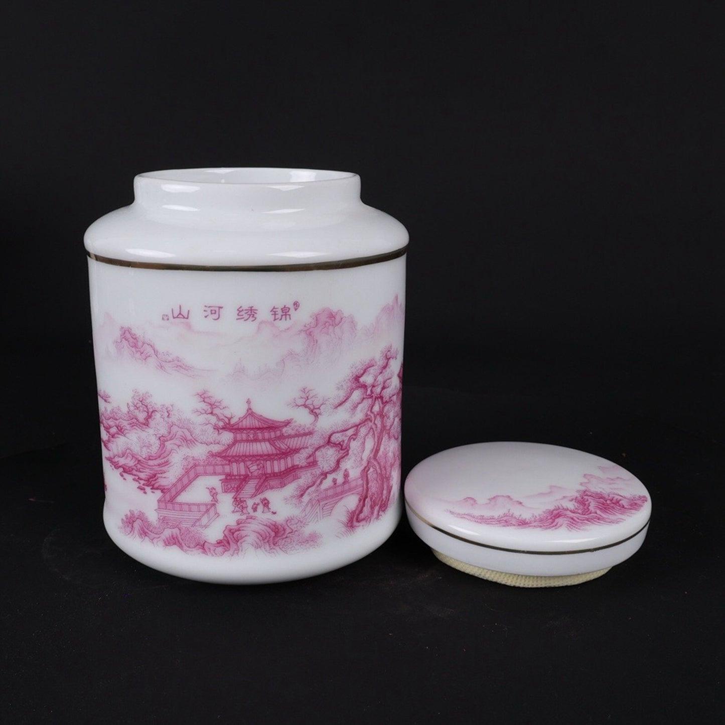 Pink and colorful tea jar with picturesque river and mountain patterns