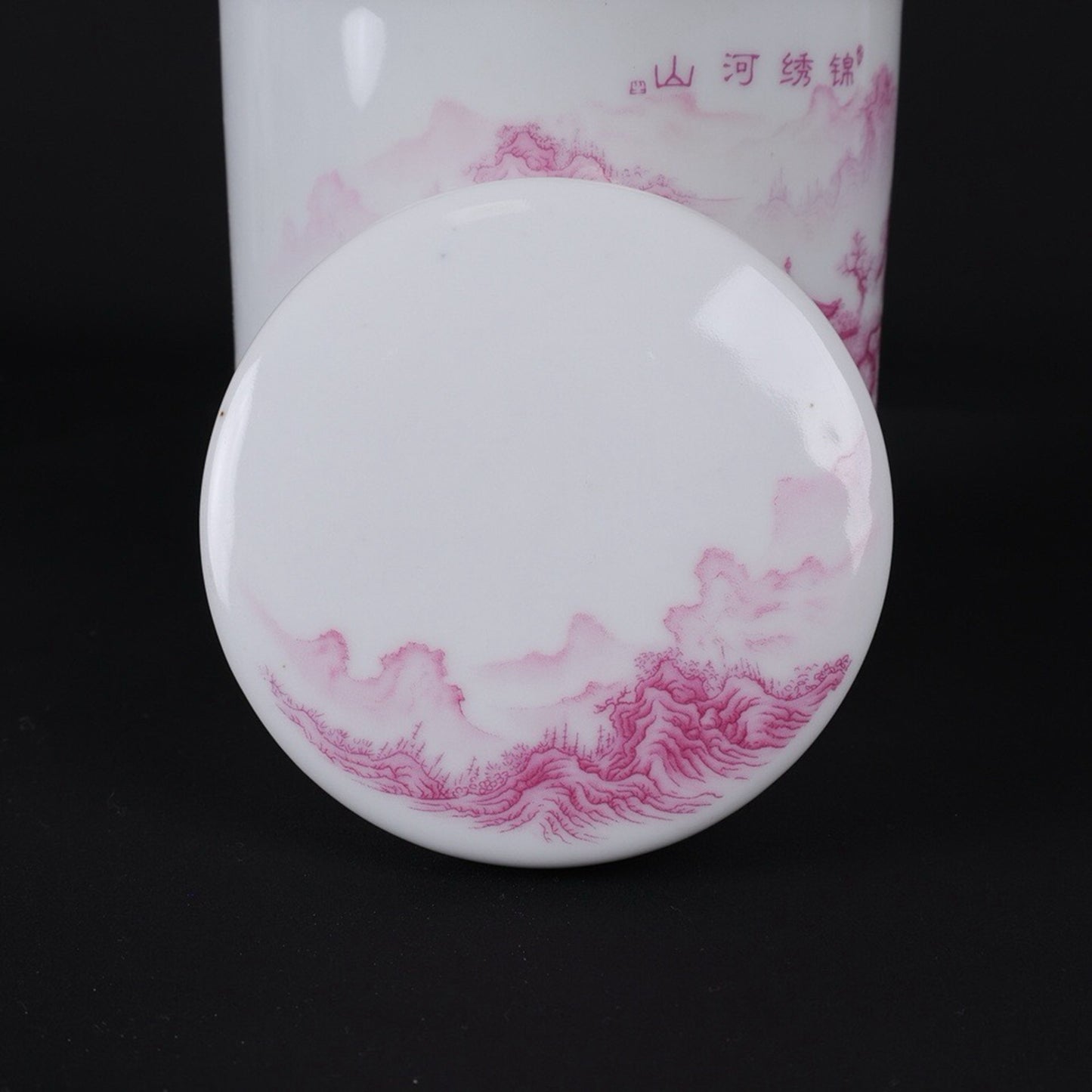 Pink and colorful tea jar with picturesque river and mountain patterns