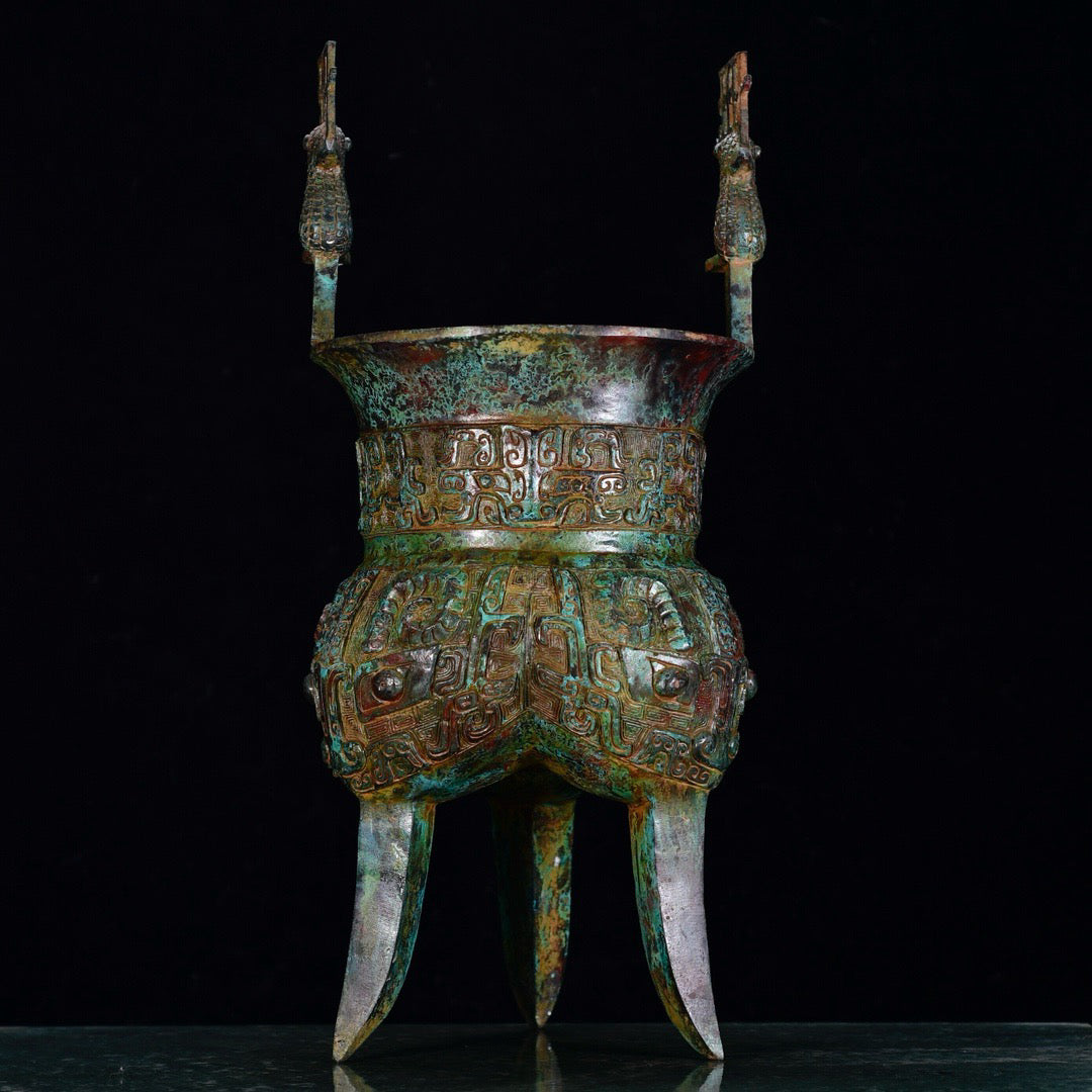 Chinese antique bronze phoenix patterned beast faced three legged bronze vessel