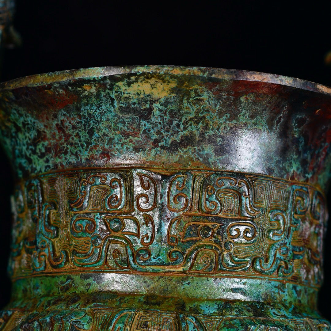 Chinese antique bronze phoenix patterned beast faced three legged bronze vessel