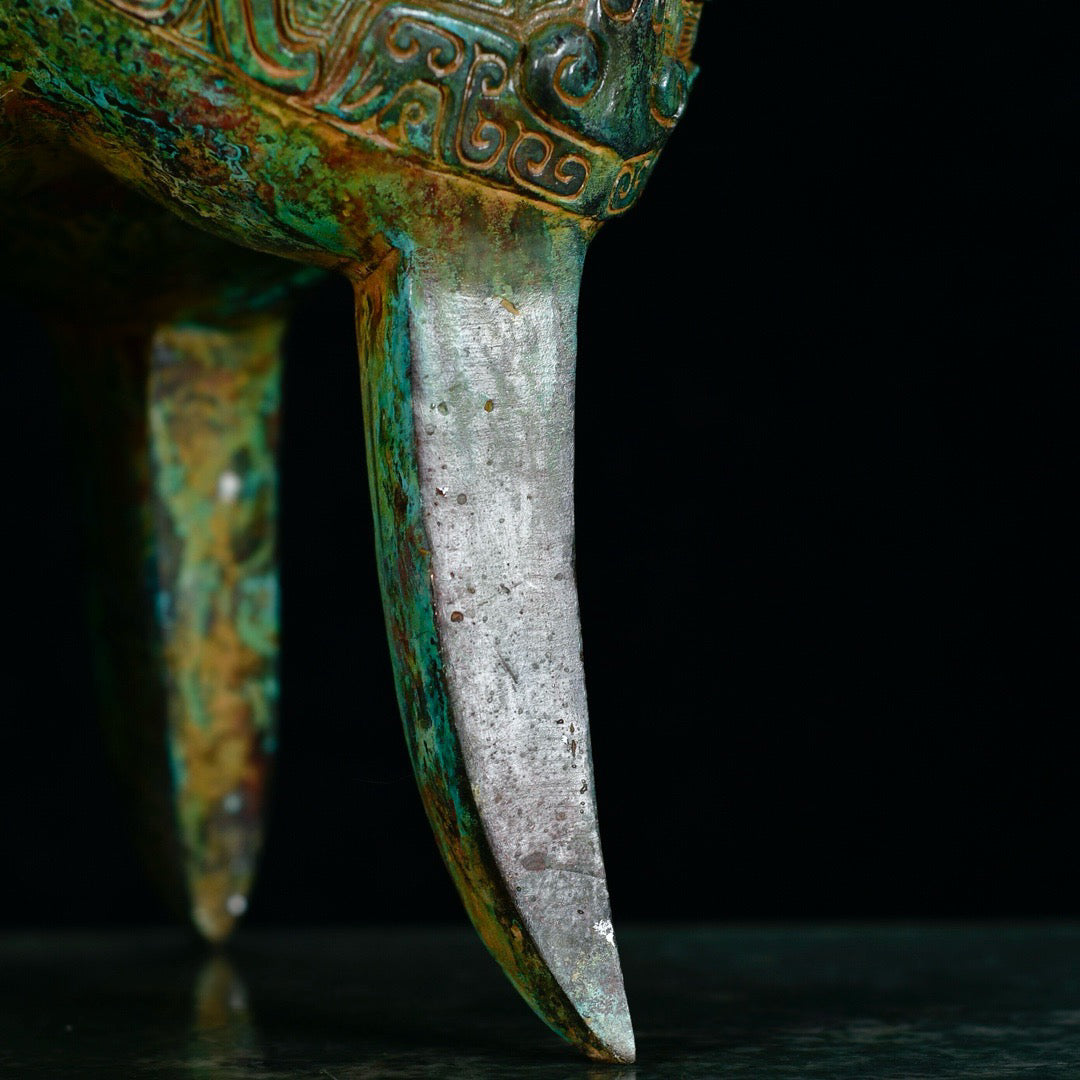 Chinese antique bronze phoenix patterned beast faced three legged bronze vessel