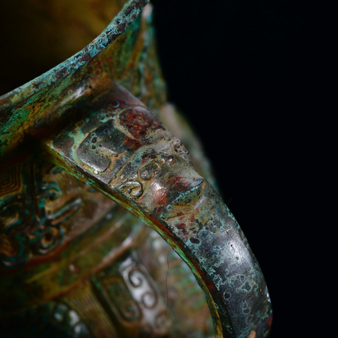 Chinese antique bronze phoenix patterned beast faced three legged bronze vessel