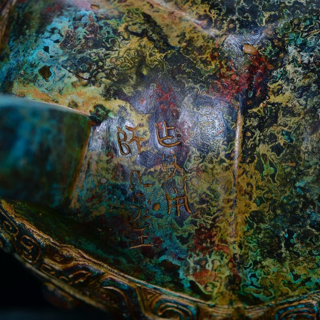 Chinese antique bronze phoenix patterned beast faced three legged bronze vessel