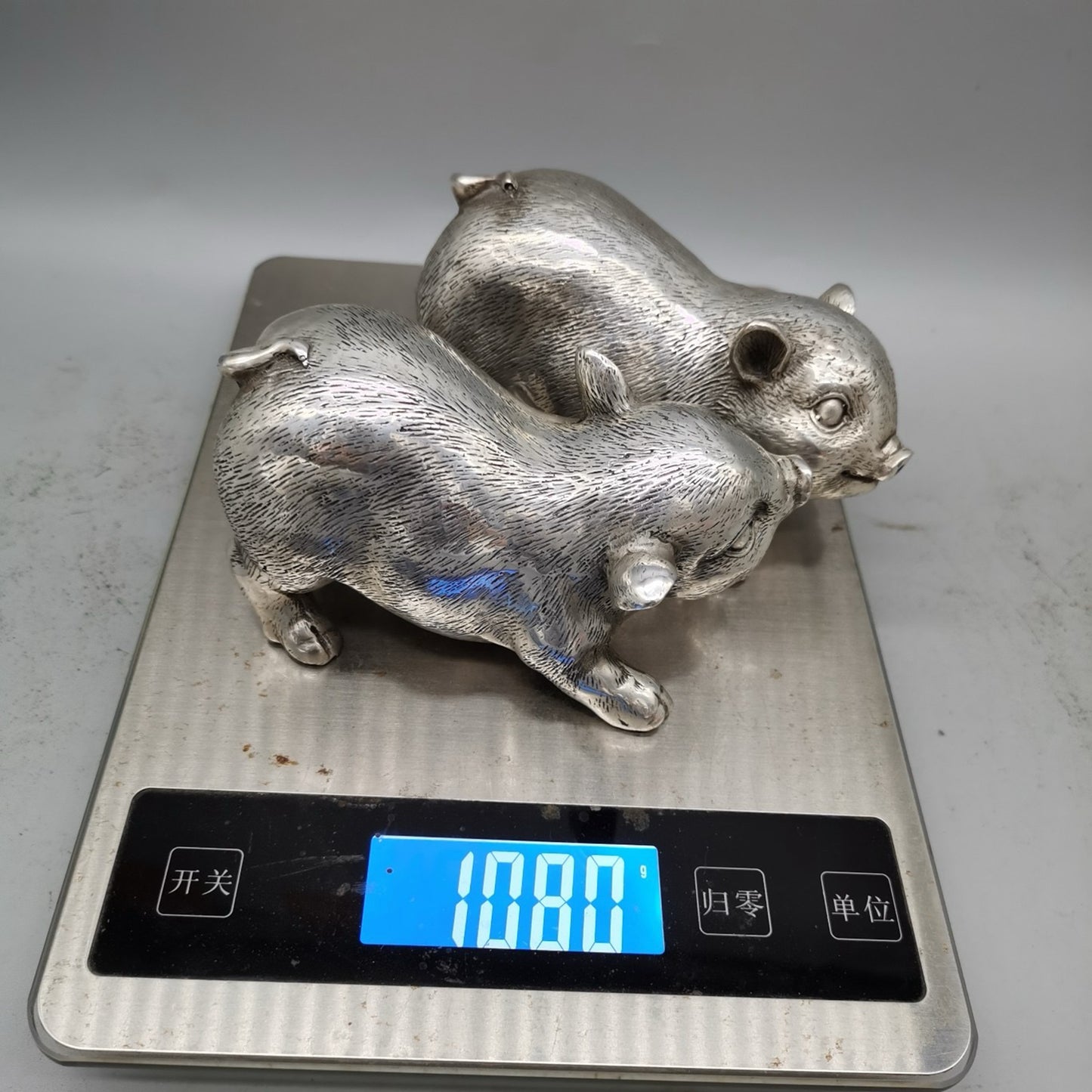 A pair of Chinese pure copper silver plated piglets for home and living room decoration