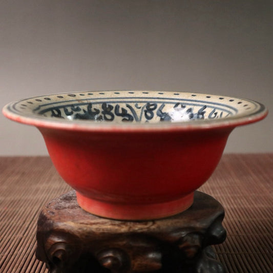 Small bowl with blue, white, and red glazed branches and lotus patterns