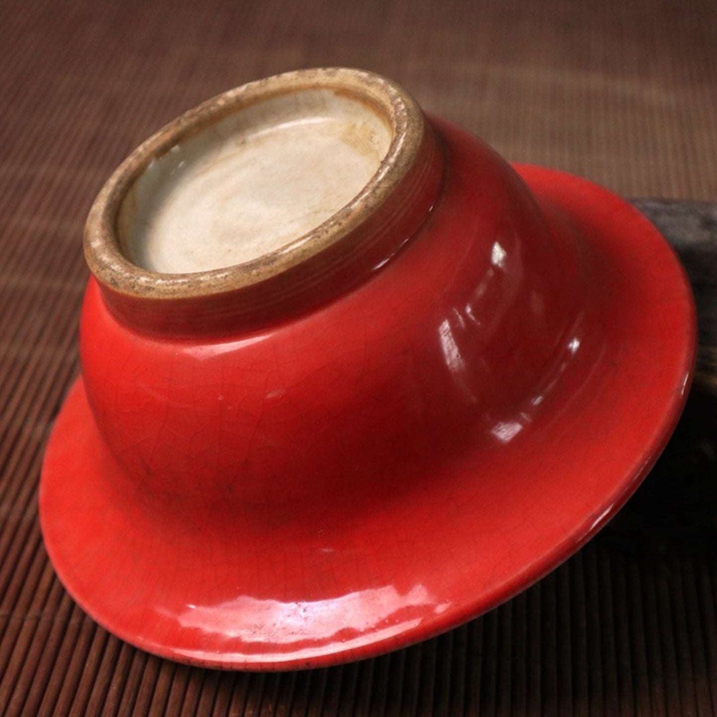 Small bowl with blue, white, and red glazed branches and lotus patterns