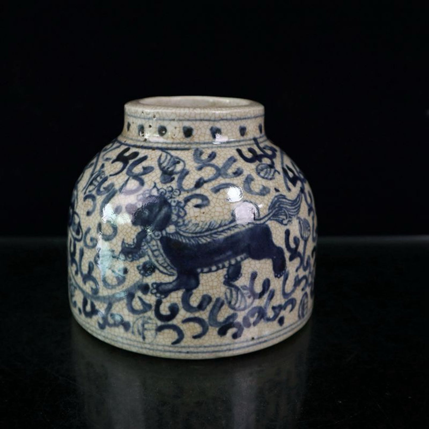 Open blue and white lion patterned jar