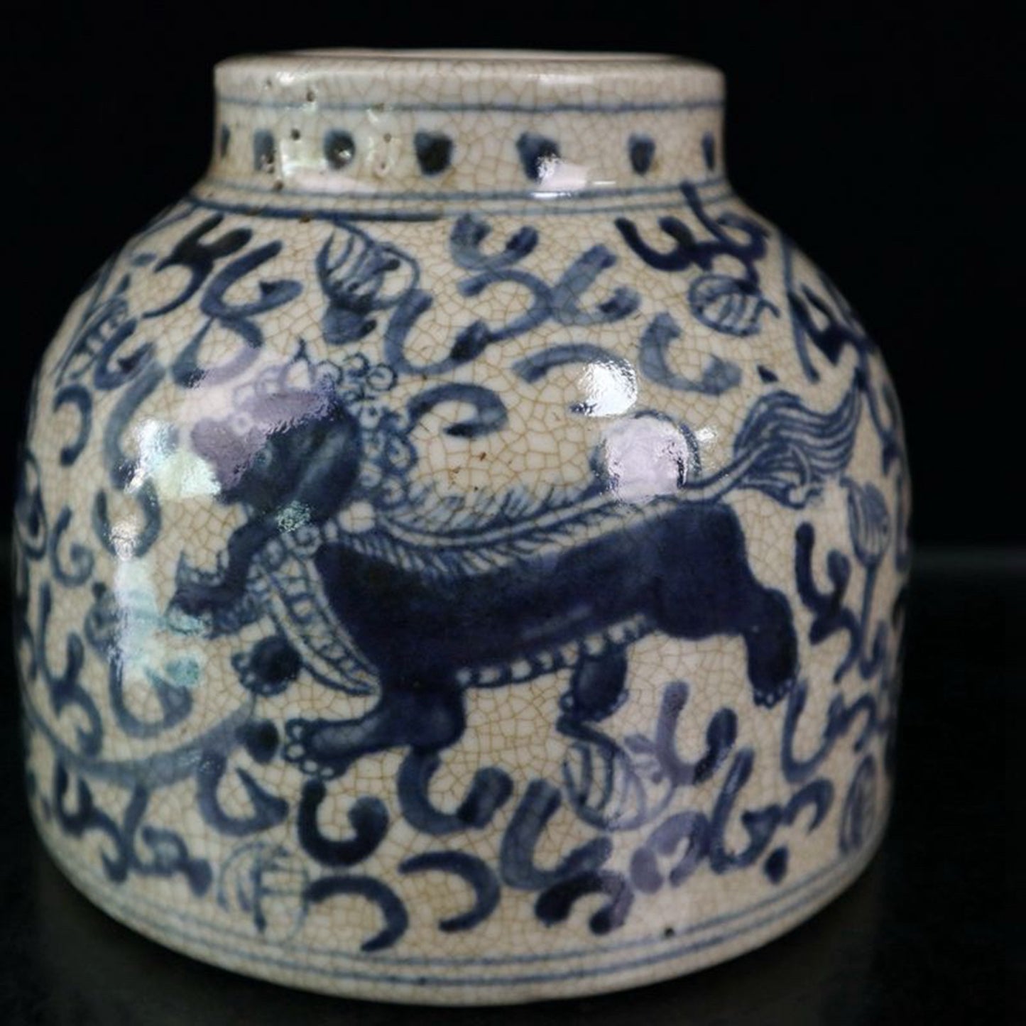 Open blue and white lion patterned jar