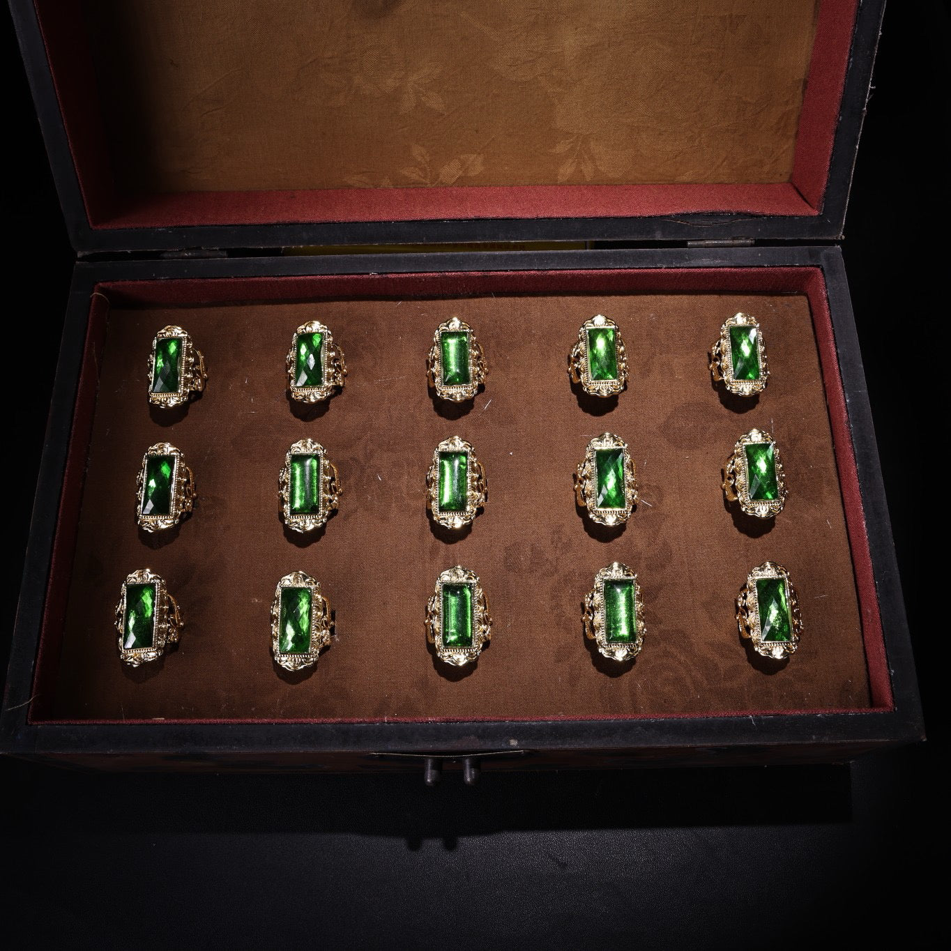 A box of Chinese antique cloisonne grandmother emerald rings