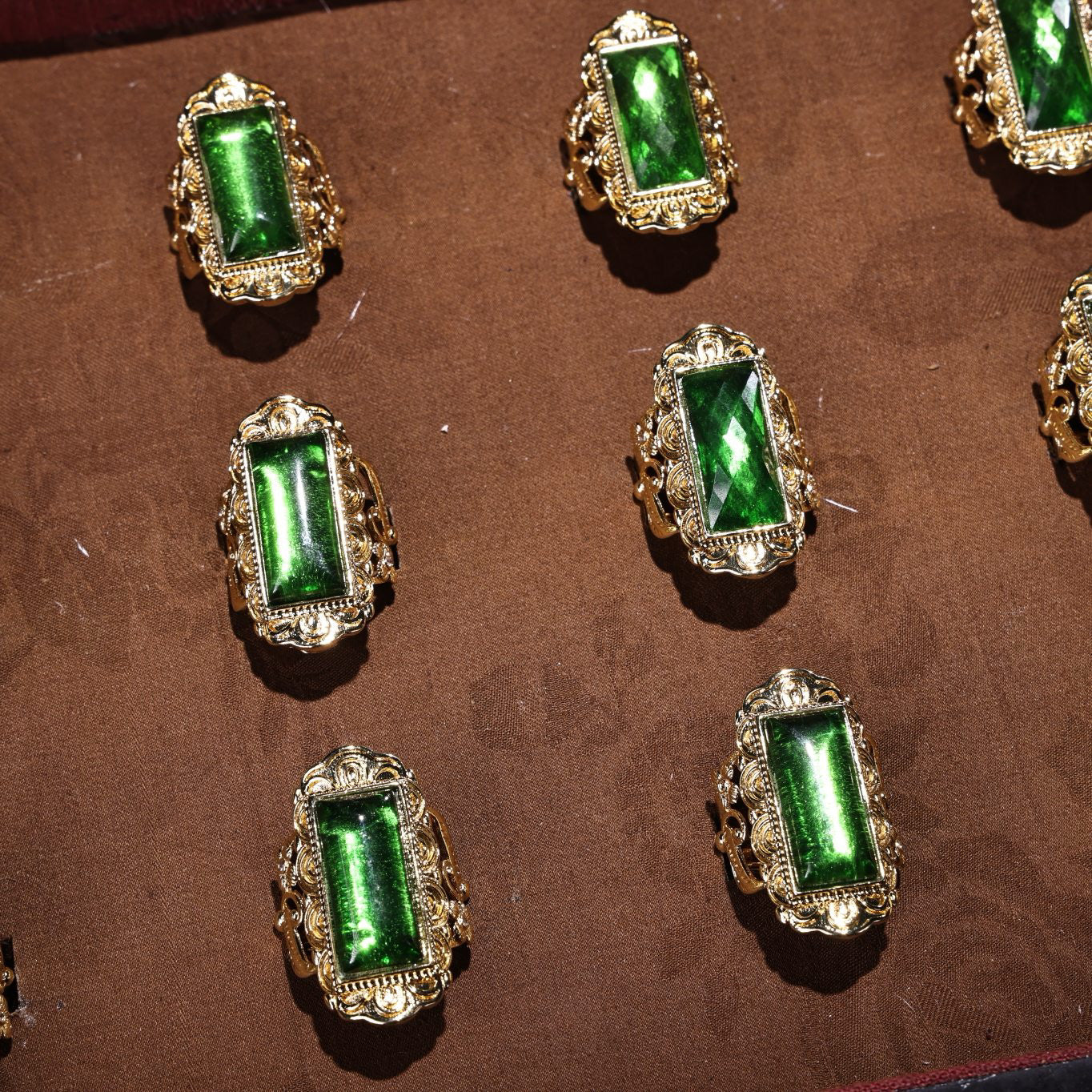 A box of Chinese antique cloisonne grandmother emerald rings