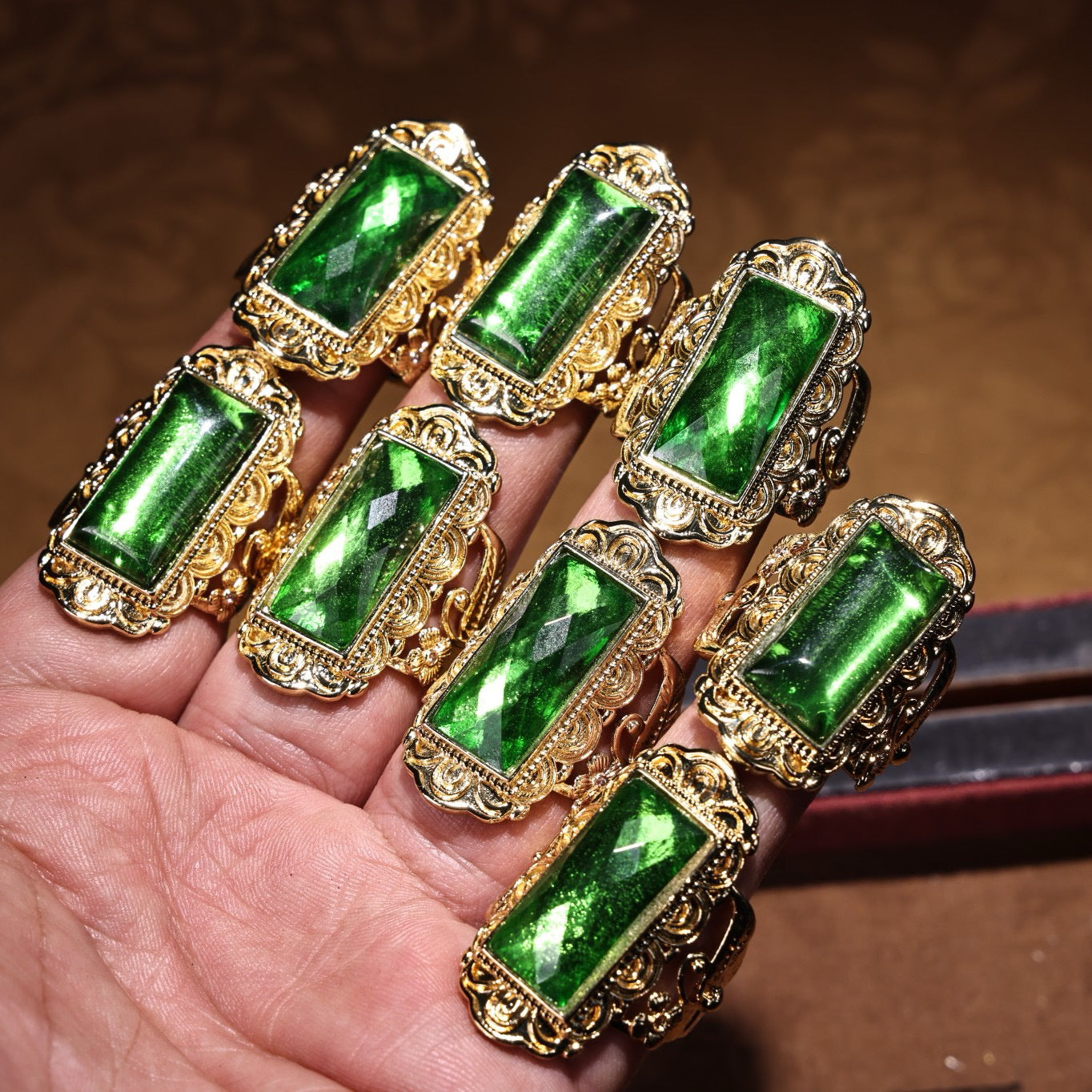 A box of Chinese antique cloisonne grandmother emerald rings