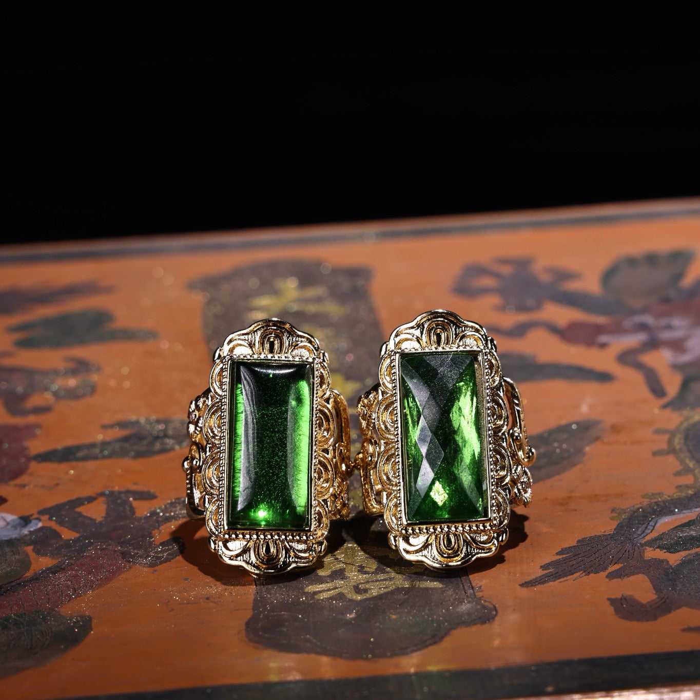 A box of Chinese antique cloisonne grandmother emerald rings