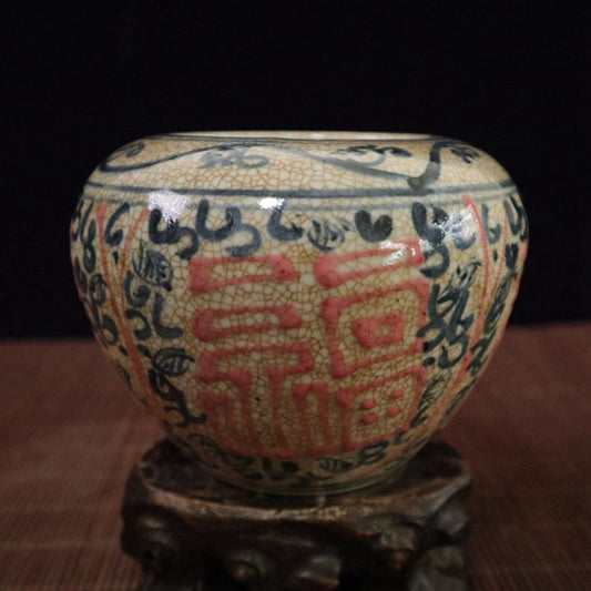 Blue and white glazed jar with red blessing pattern and sky shaped design