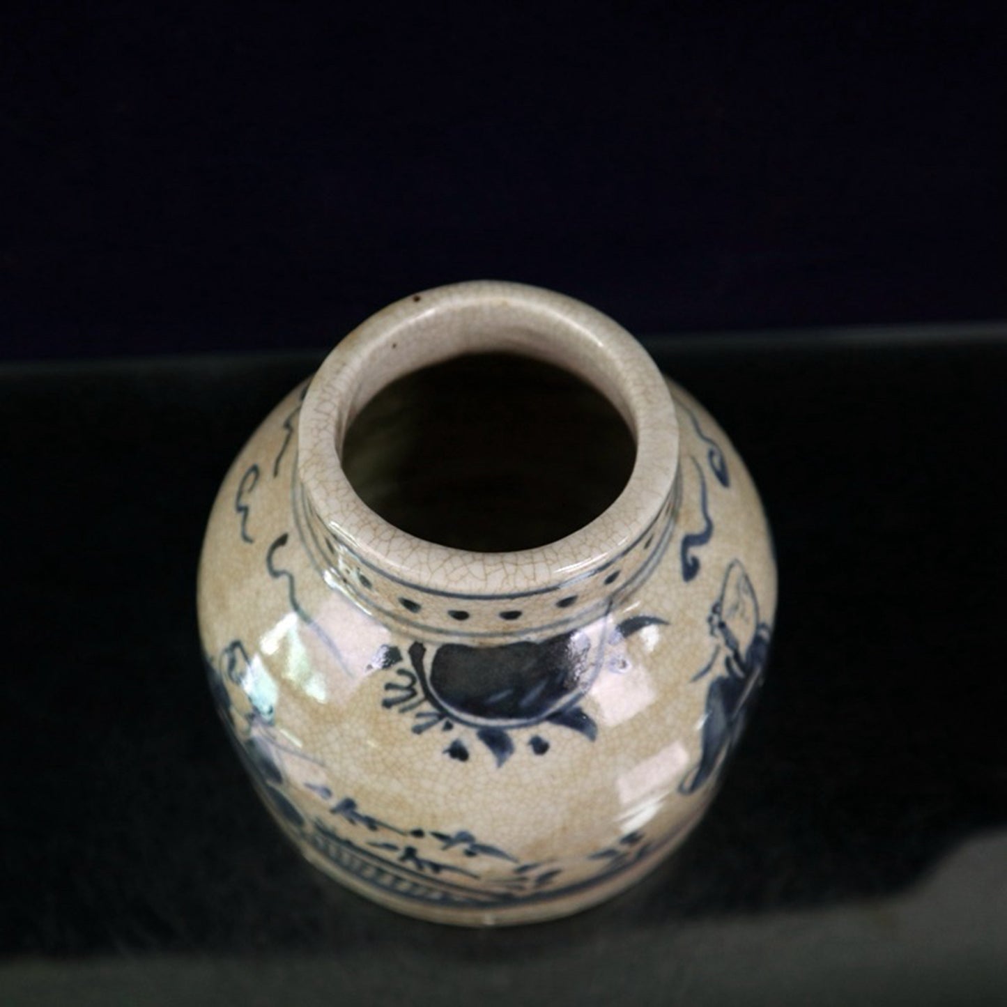 Open blue and white figure patterned jar