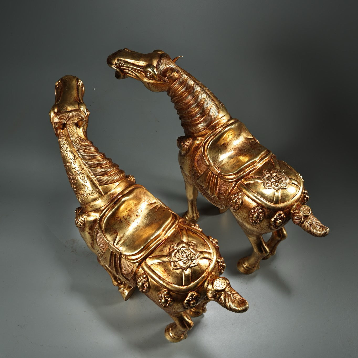 A pair of Chinese antique pure copper high relief carved and gilded Tang horses