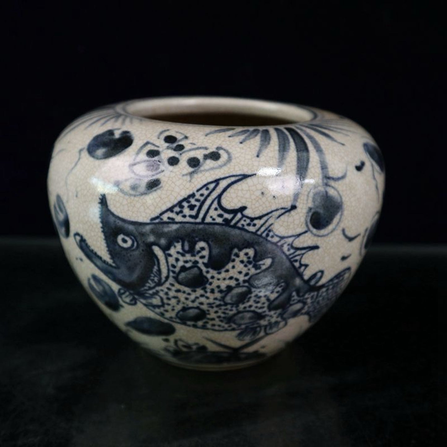 Open blue and white fish and algae patterned jar