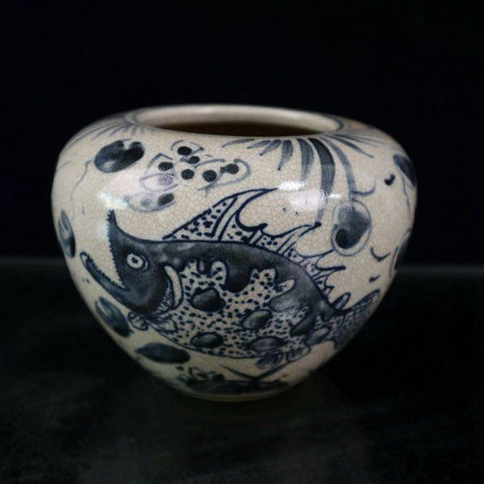 Open blue and white fish and algae patterned jar